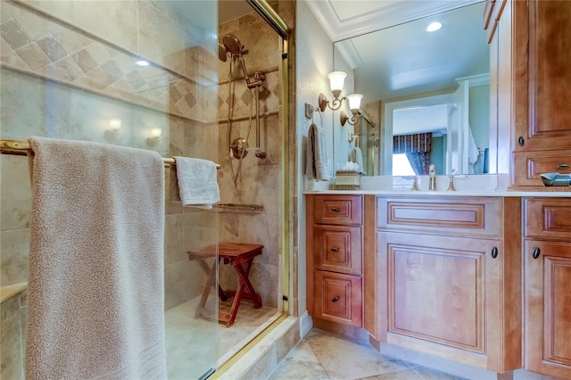 bathroom featuring crown molding, vanity, and walk in shower