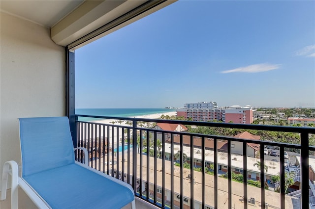 balcony with a view of the beach and a water view