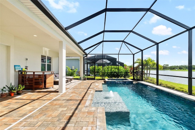 view of swimming pool with a patio, an in ground hot tub, a lanai, an outdoor bar, and a water view