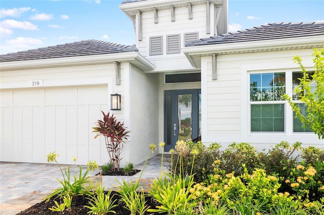 entrance to property featuring a garage