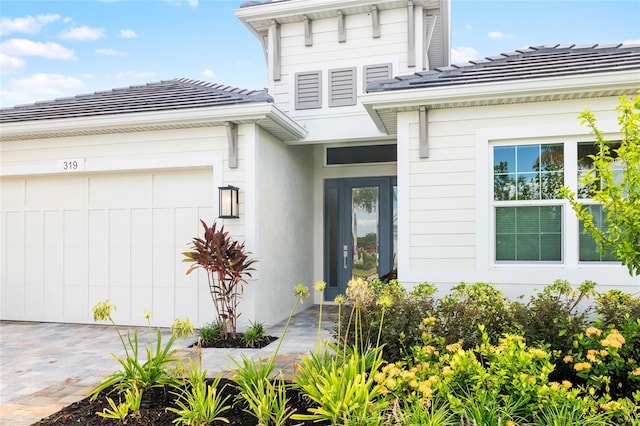 doorway to property featuring a garage