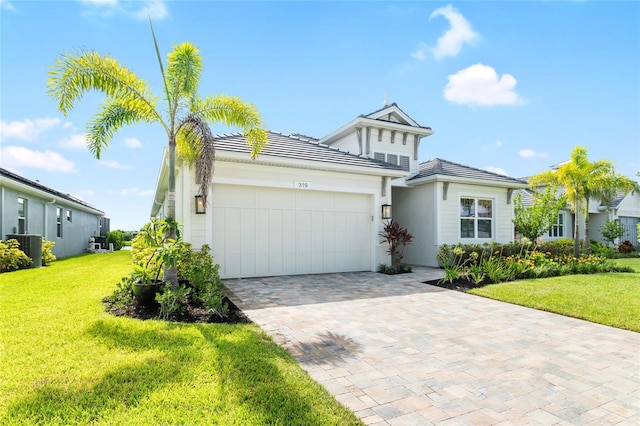 view of front facade featuring a garage and a front yard