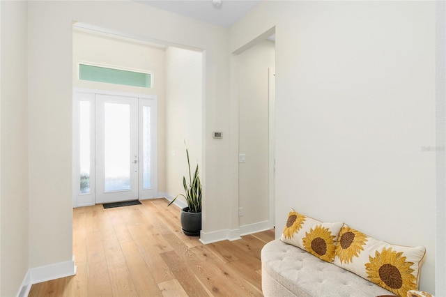 foyer entrance with light wood-type flooring