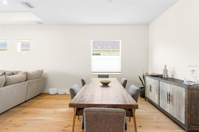 dining space with light wood-type flooring