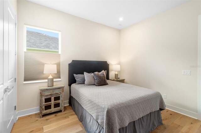 bedroom with light hardwood / wood-style flooring