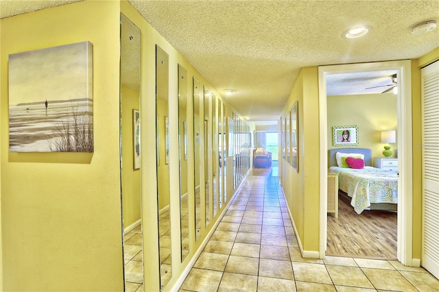 hallway featuring light tile patterned floors