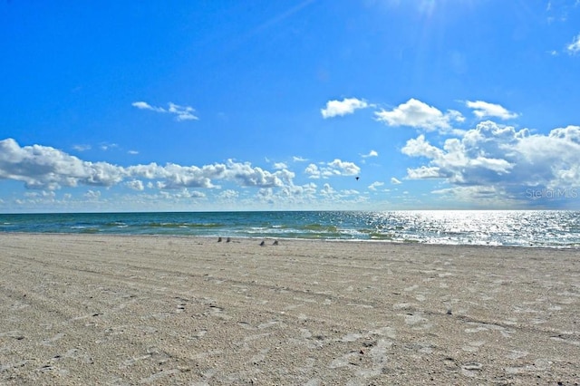 view of water feature with a beach view