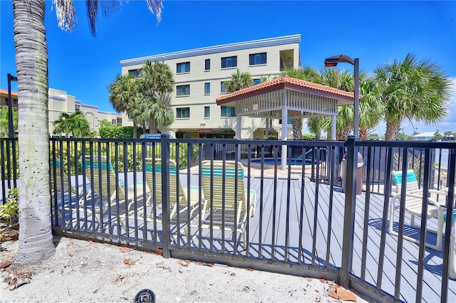 view of gate featuring a community pool