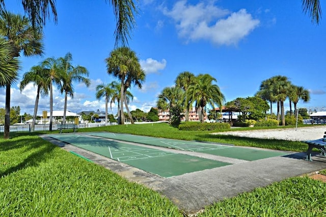 view of property's community with a lawn