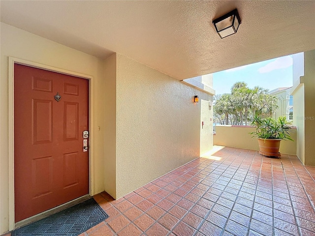 7532 Bayshore Dr Unit 205, Treasure Island, FL 33706 - property entrance featuring a balcony and stucco siding