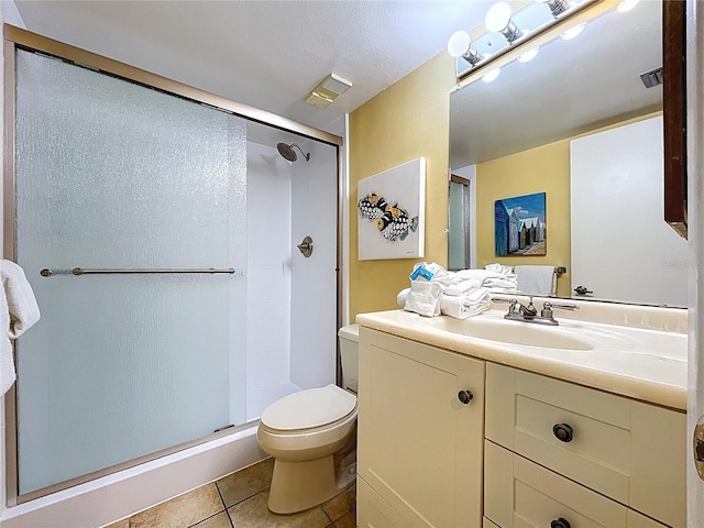 7532 Bayshore Dr Unit 205, Treasure Island, FL 33706 - bathroom with toilet, a stall shower, tile patterned floors, and vanity