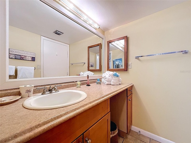 7532 Bayshore Dr Unit 205, Treasure Island, FL 33706 - bathroom with vanity, tile patterned floors, and baseboards