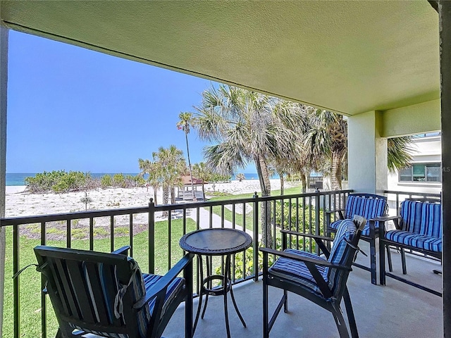 7532 Bayshore Dr Unit 205, Treasure Island, FL 33706 - balcony with view of water and beach