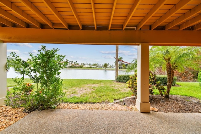 view of patio with a water view