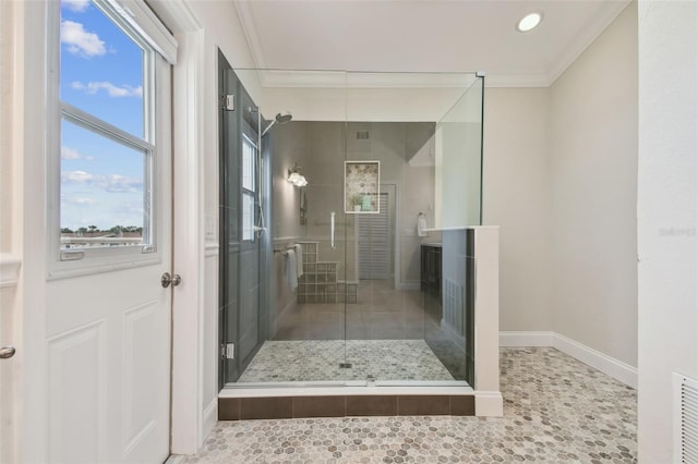 bathroom featuring walk in shower and ornamental molding