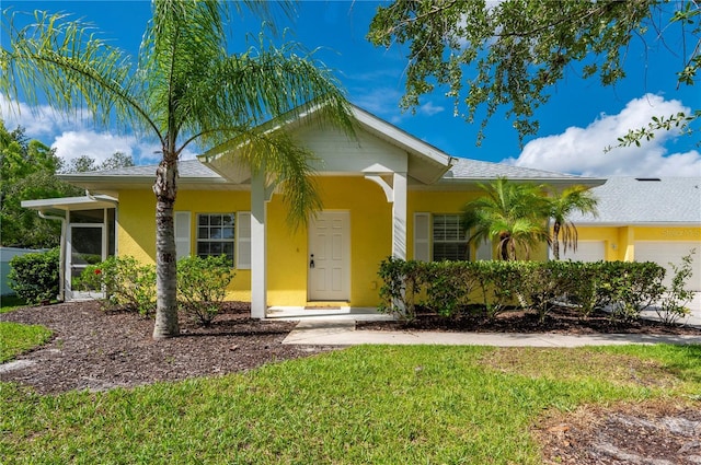 ranch-style house with a front lawn