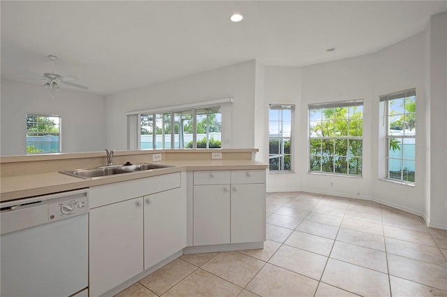 kitchen with dishwasher, white cabinets, ceiling fan, and sink