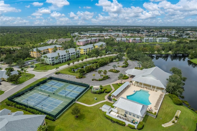 birds eye view of property with a water view