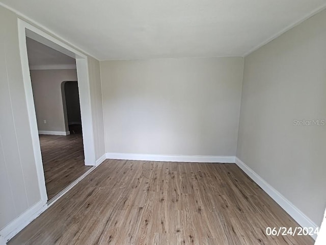 spare room featuring hardwood / wood-style flooring