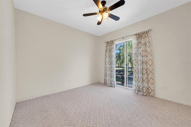 unfurnished room featuring ceiling fan and light colored carpet