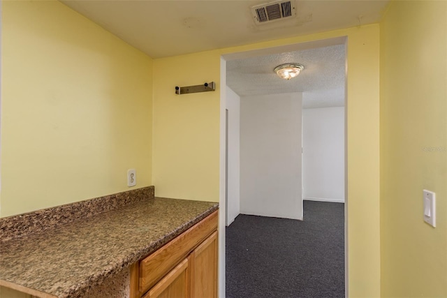 interior space with a textured ceiling