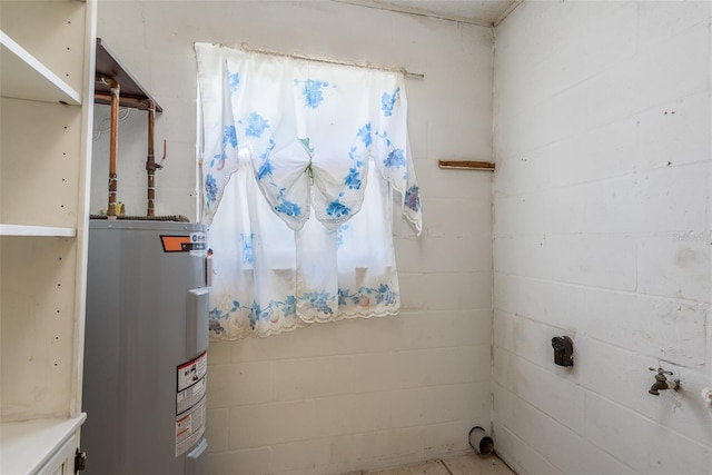 utility room with electric water heater