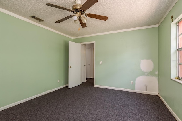 spare room with ceiling fan, crown molding, and a textured ceiling