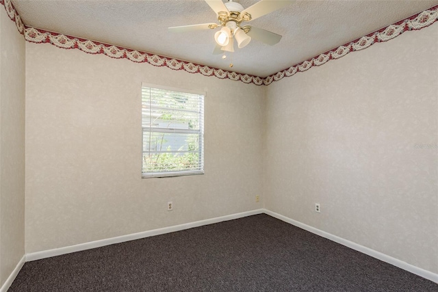 spare room featuring ceiling fan, carpet, and a textured ceiling