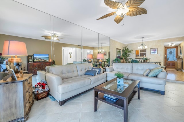 tiled living room with crown molding and a notable chandelier