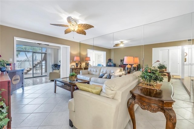 tiled living room featuring ceiling fan