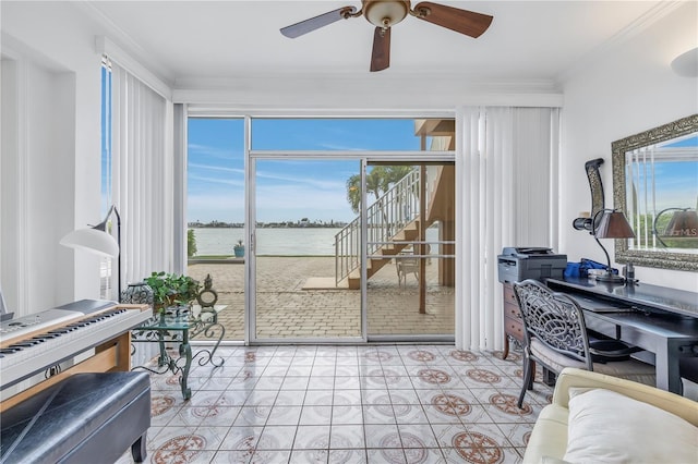 tiled office with ceiling fan, a water view, and ornamental molding