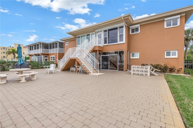 rear view of house featuring a patio area