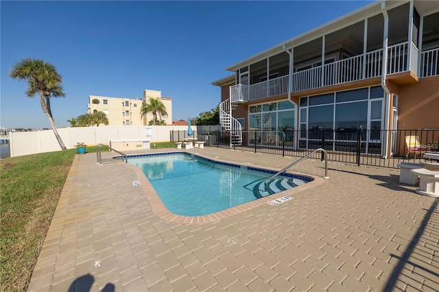 view of pool featuring a patio