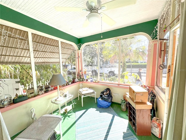 sunroom featuring a wealth of natural light and ceiling fan