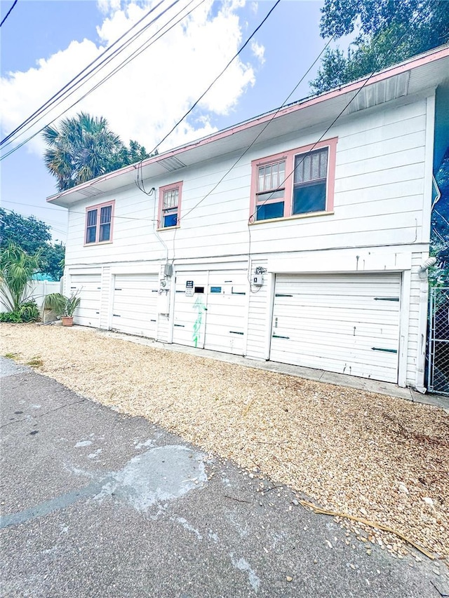 view of side of property featuring a garage