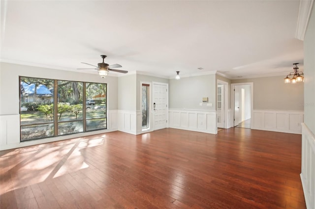 unfurnished living room with crown molding, dark hardwood / wood-style flooring, and ceiling fan with notable chandelier