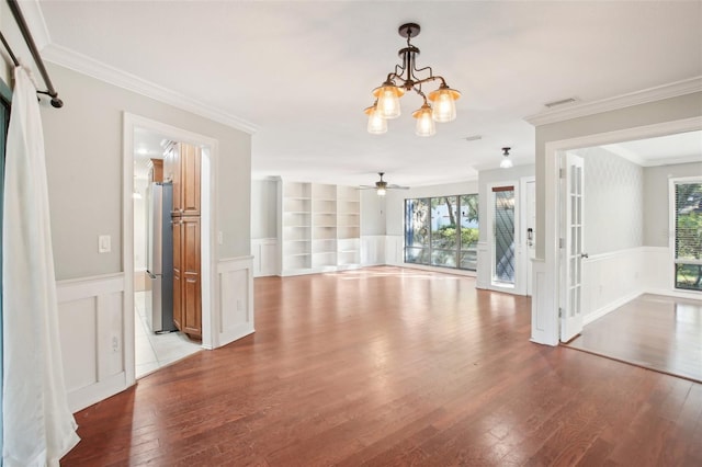 interior space with light hardwood / wood-style flooring, built in features, plenty of natural light, and crown molding