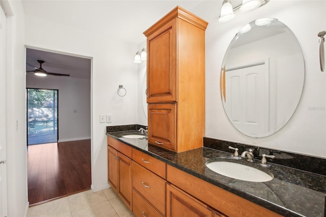 bathroom with hardwood / wood-style floors, vanity, and ceiling fan