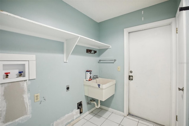 clothes washing area with washer hookup, electric dryer hookup, and light tile patterned floors