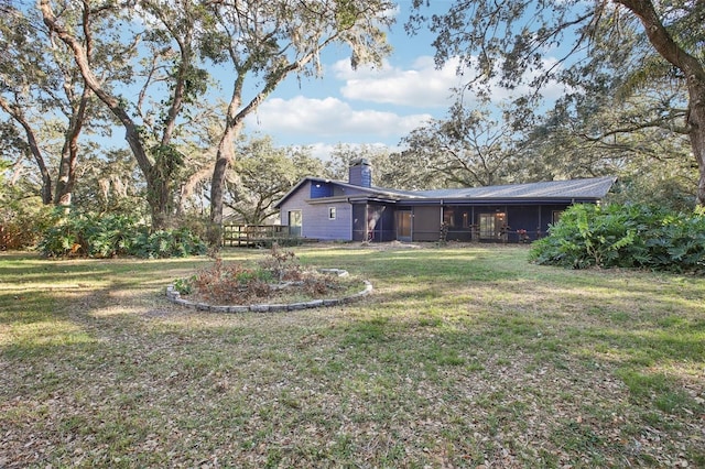 view of yard featuring a sunroom