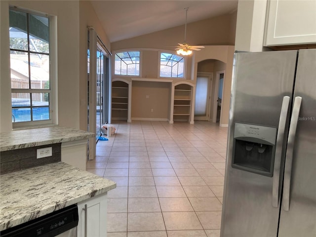 kitchen with stainless steel fridge, light stone counters, dishwashing machine, ceiling fan, and white cabinets