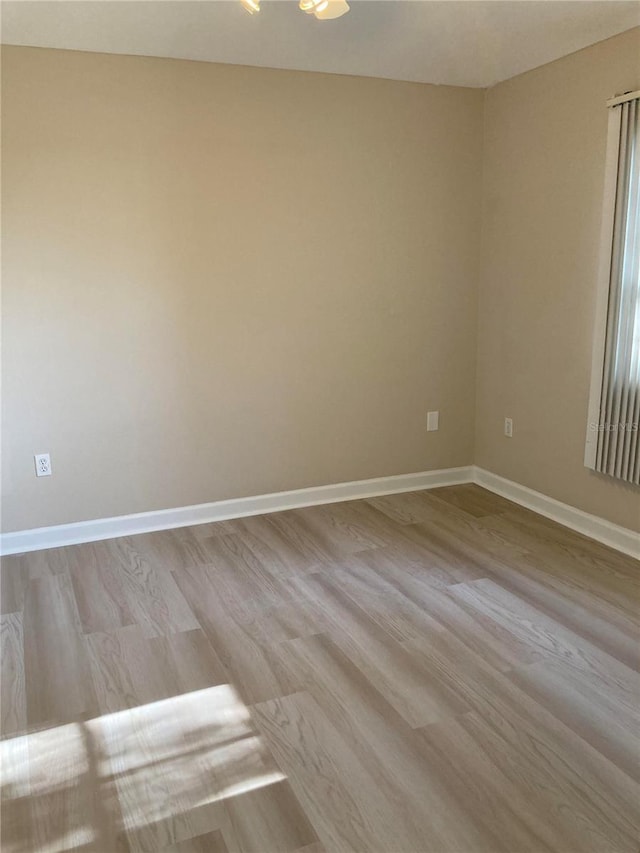 spare room with light hardwood / wood-style floors