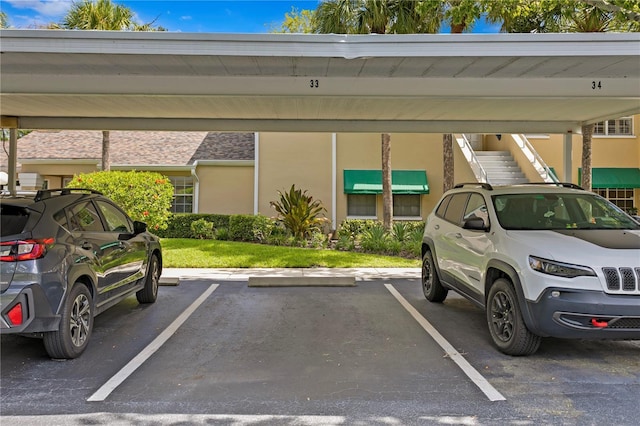 view of vehicle parking featuring a carport