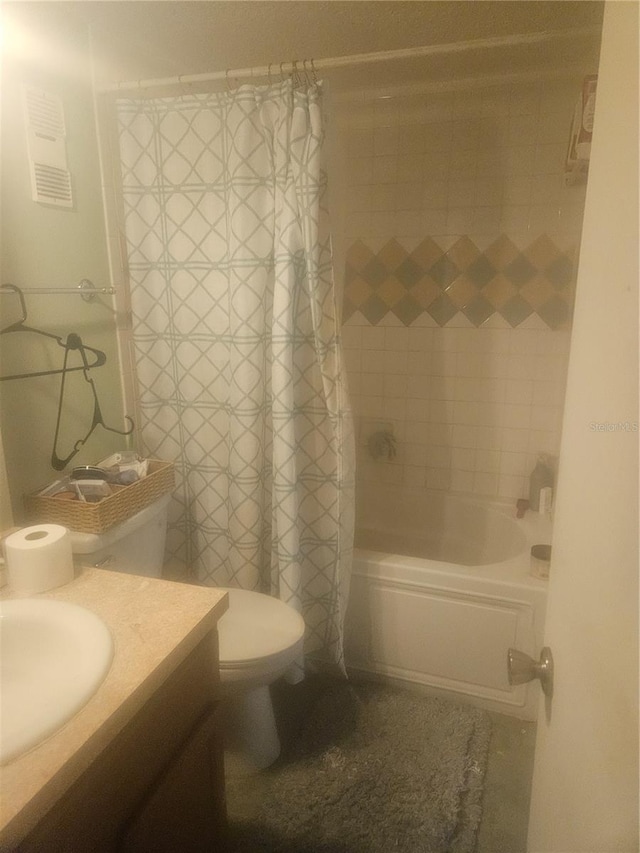 full bathroom featuring vanity, shower / bathtub combination with curtain, and toilet