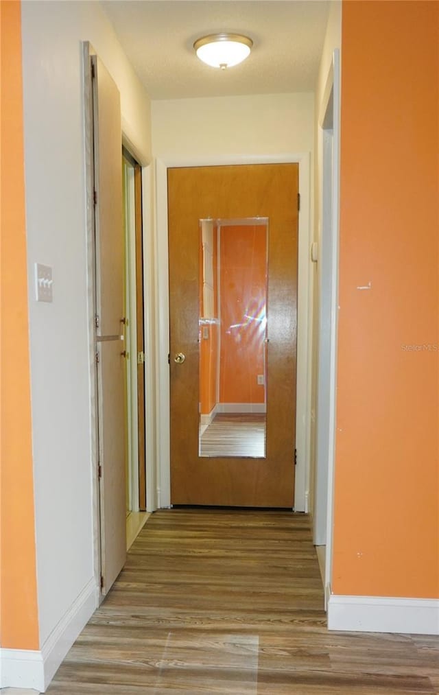 corridor featuring light hardwood / wood-style floors