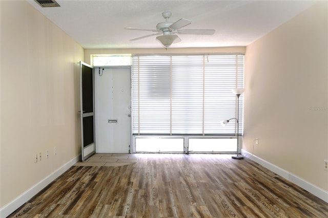 4349 Tahitian Gardens Cir Unit G, Holiday, FL 34691 - unfurnished room featuring wood finished floors, ceiling fan, and baseboards
