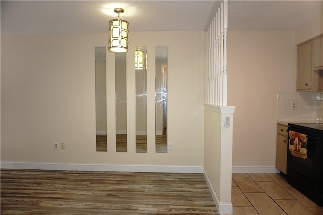4349 Tahitian Gardens Cir Unit G, Holiday, FL 34691 - unfurnished dining area featuring baseboards and light wood-type flooring