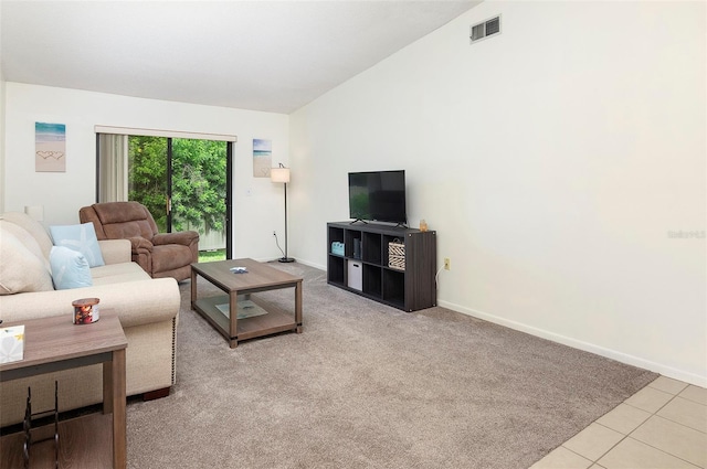 tiled living room with lofted ceiling