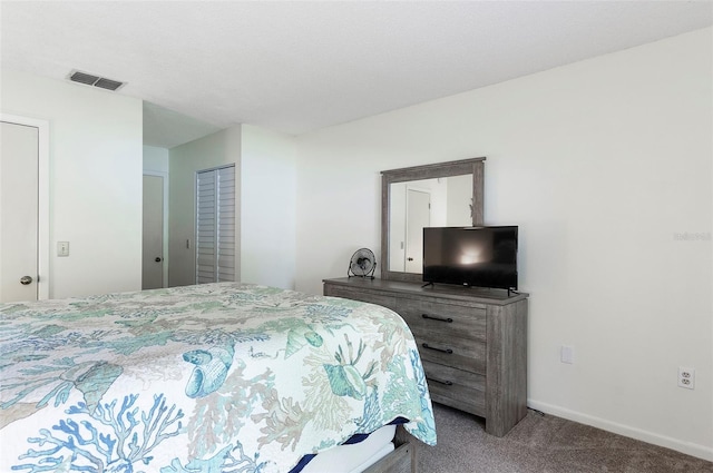 carpeted bedroom featuring a closet