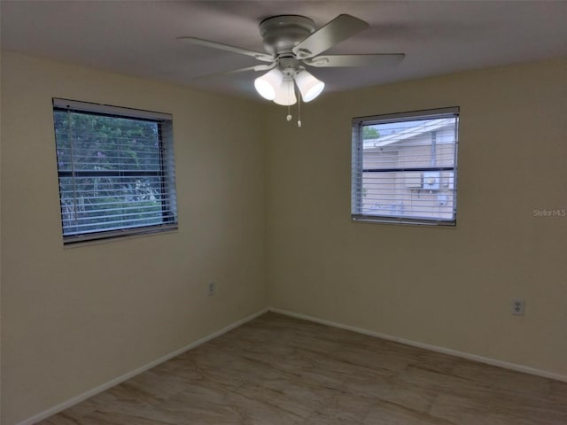 unfurnished room featuring ceiling fan